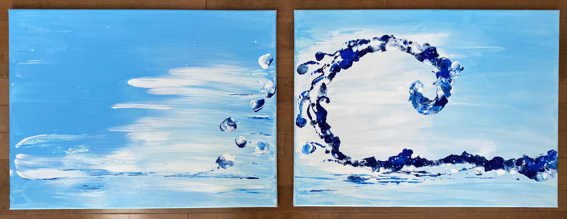 A diptych abstract art painting of a blue and white wave with bold droplets of water streaming out