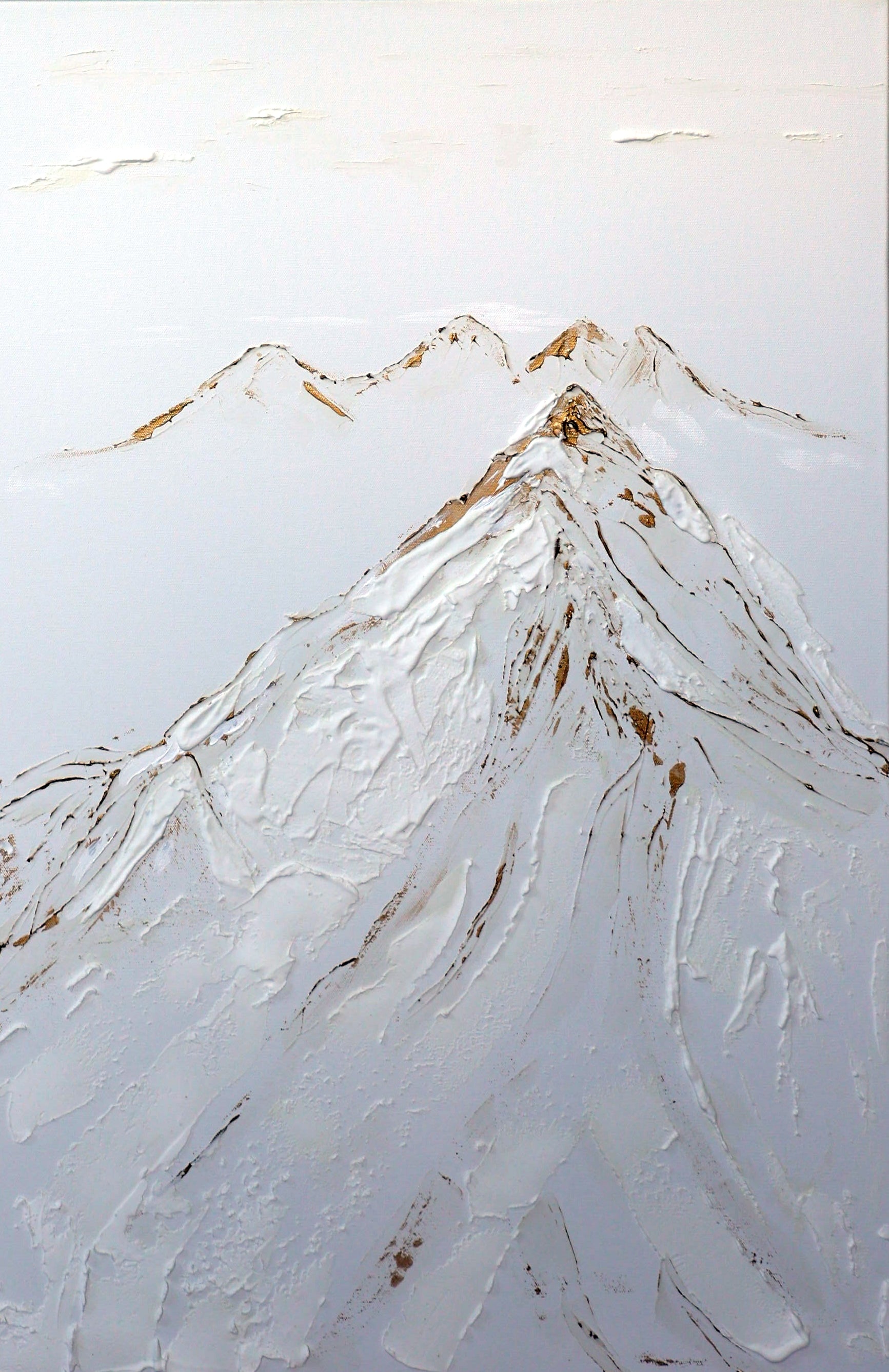 A canvas painting featuring a stylized mountain with a gold-colored peak, set against a white snowy background.